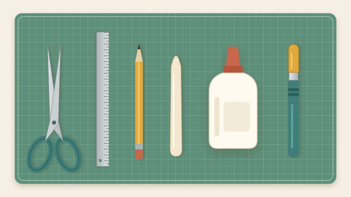Scissors, a metal ruler, a pencil, a bone folder, a bottle of white glue and a capped craft knife in a row on a green cutting mat