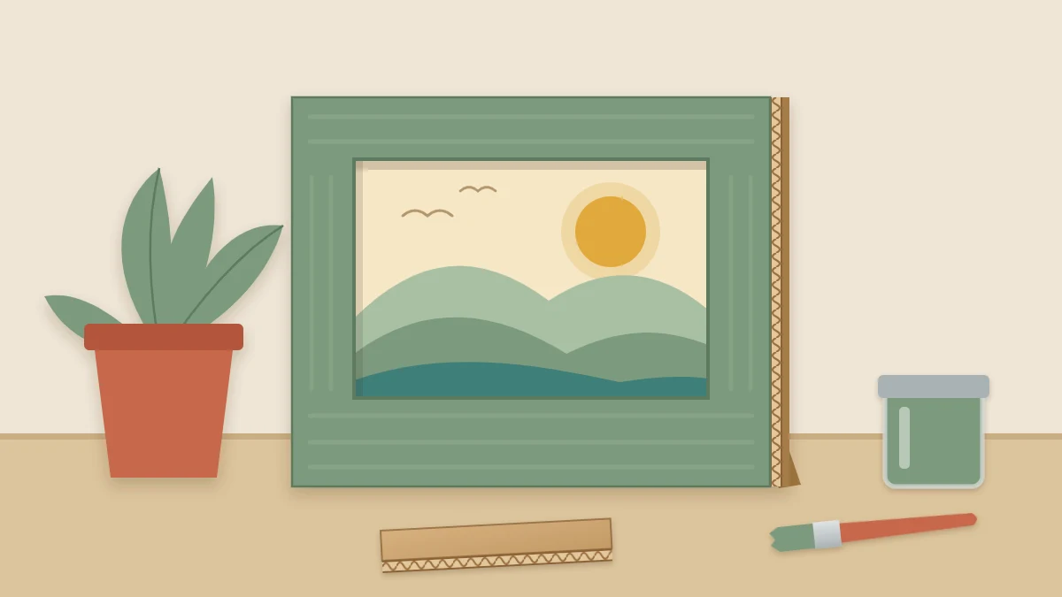 A standing cardboard picture frame painted sage green, holding a simple landscape picture of hills and a sun