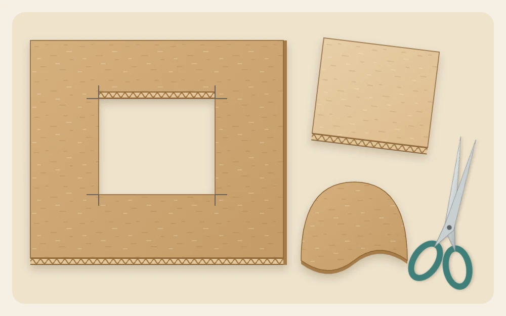 Cardboard panel with a rectangular window removed, the cut-out rectangle beside it and a curved piece cut with scissors